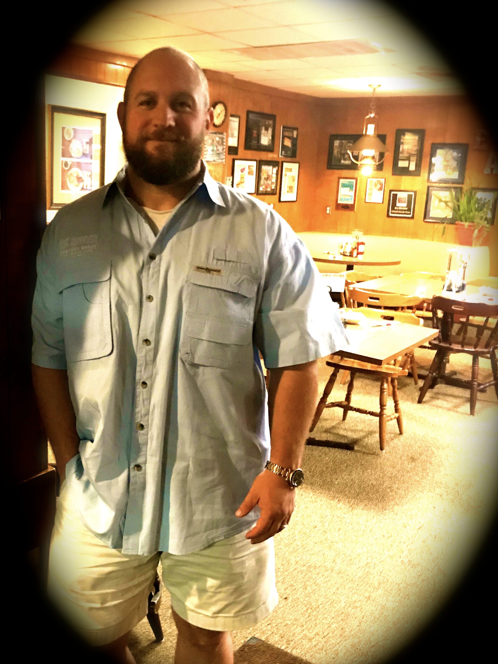 A man standing in front of some tables