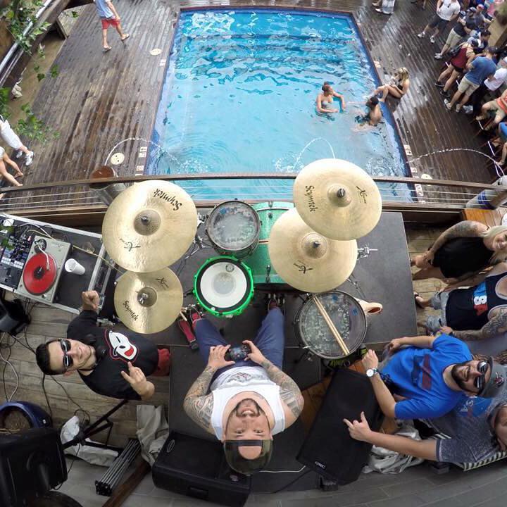 A group of people gathered around a pool