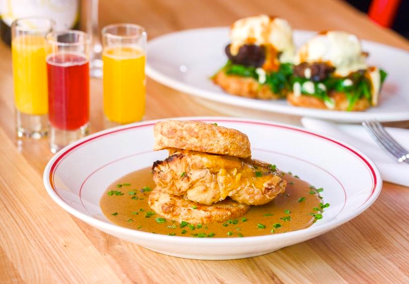 A plate of food on top of a wooden table.