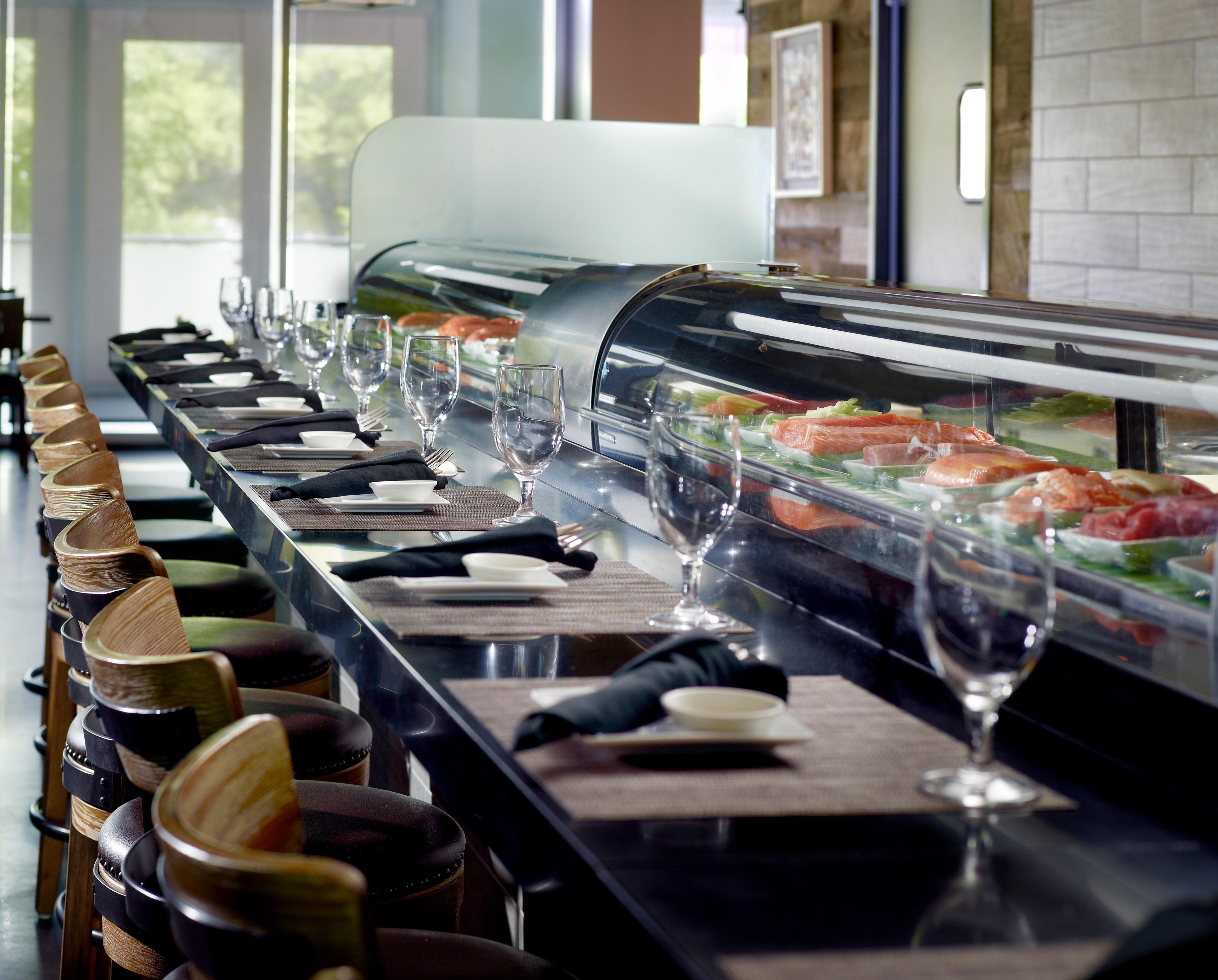 A long table with many glasses and plates on it