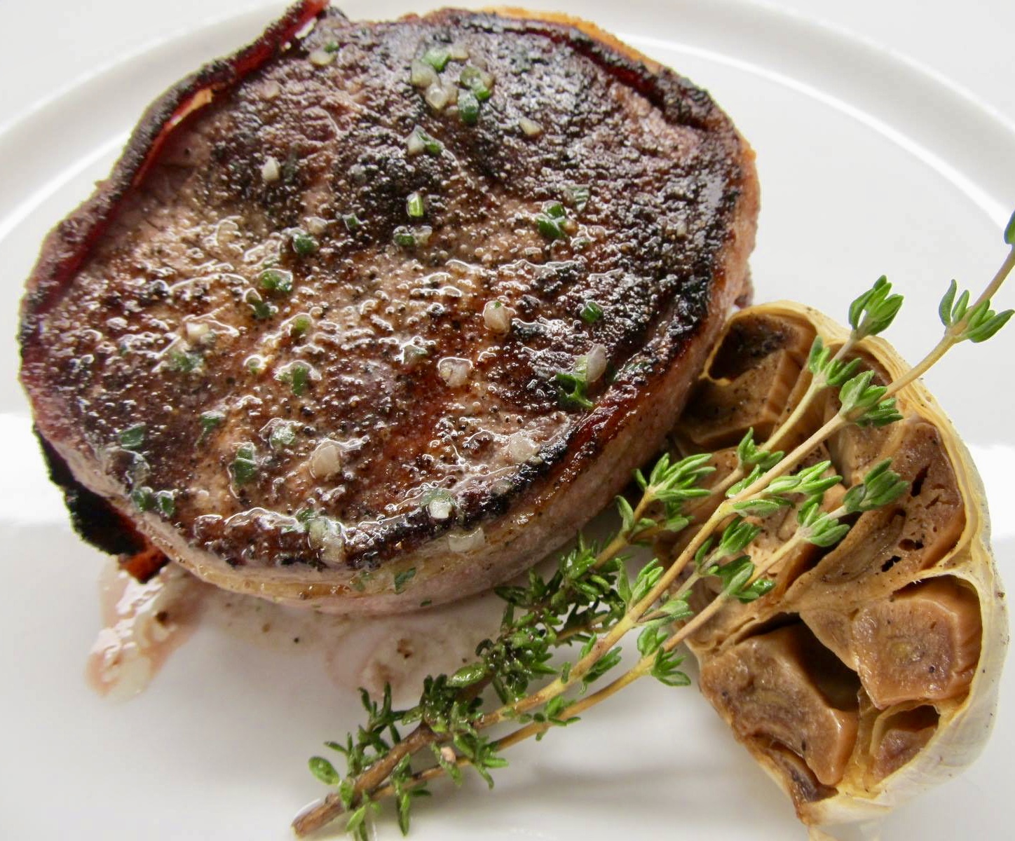 A plate of food with meat and vegetables on it.