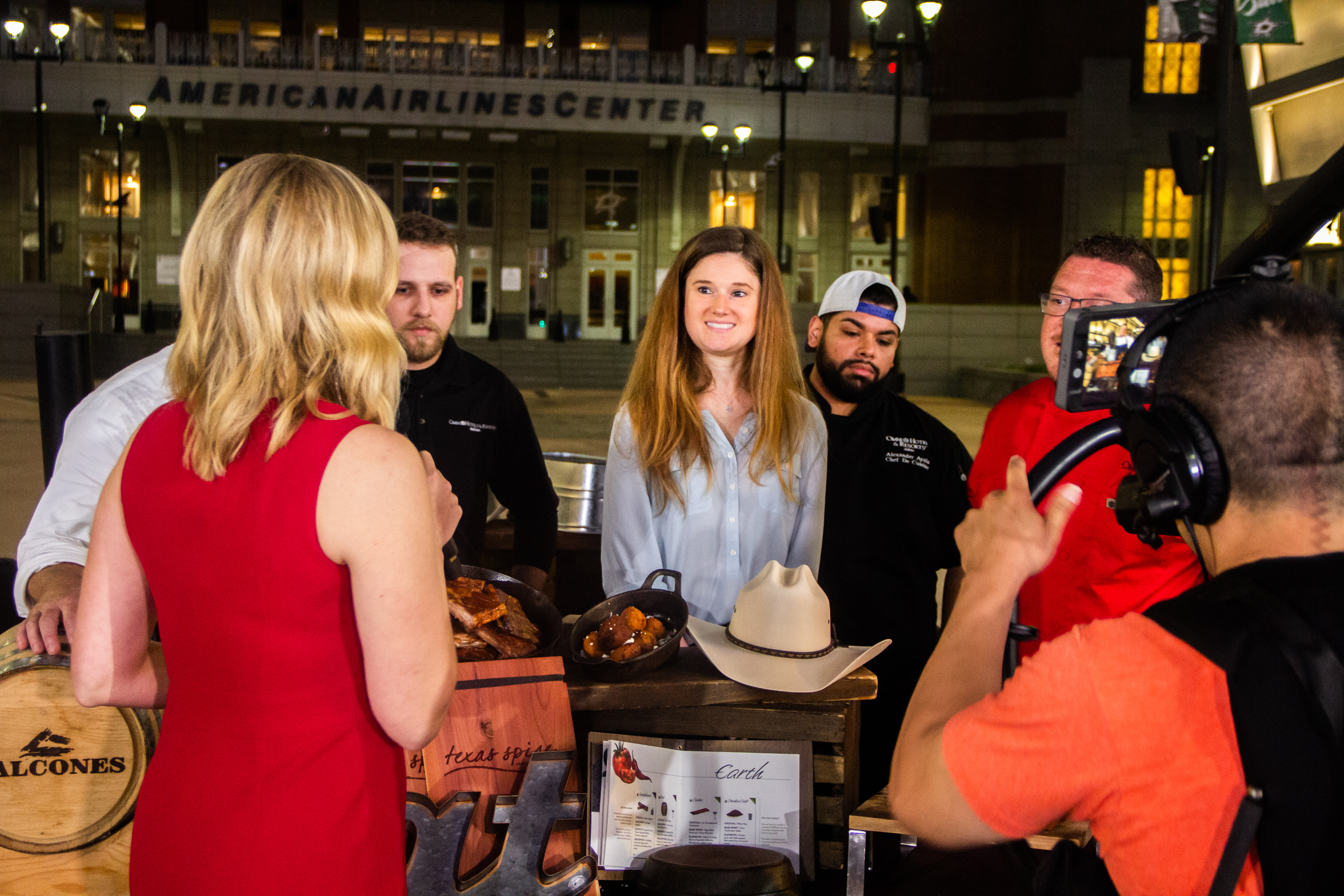 A group of people standing around a table.