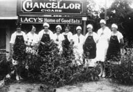 A group of women standing next to each other.