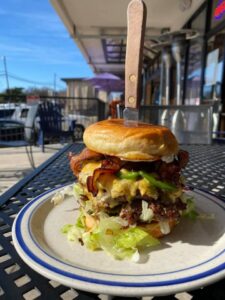 A large sandwich on top of a bun.
