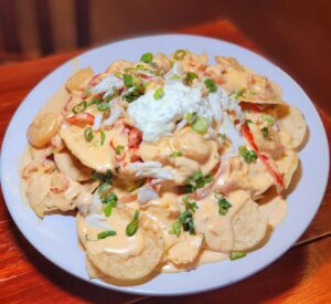 A plate of food on top of a wooden table.
