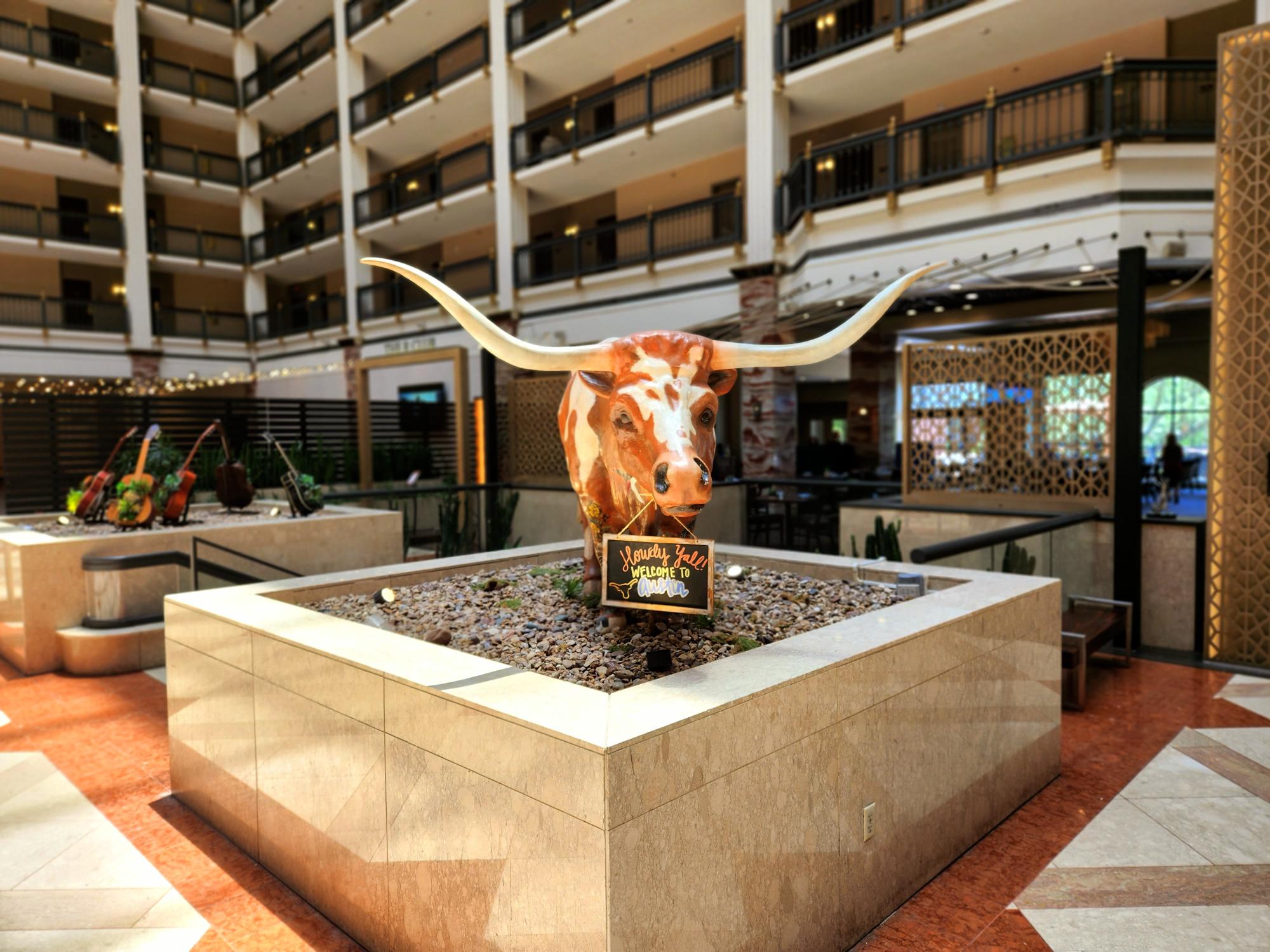 A couple of people standing in front of an atrium.