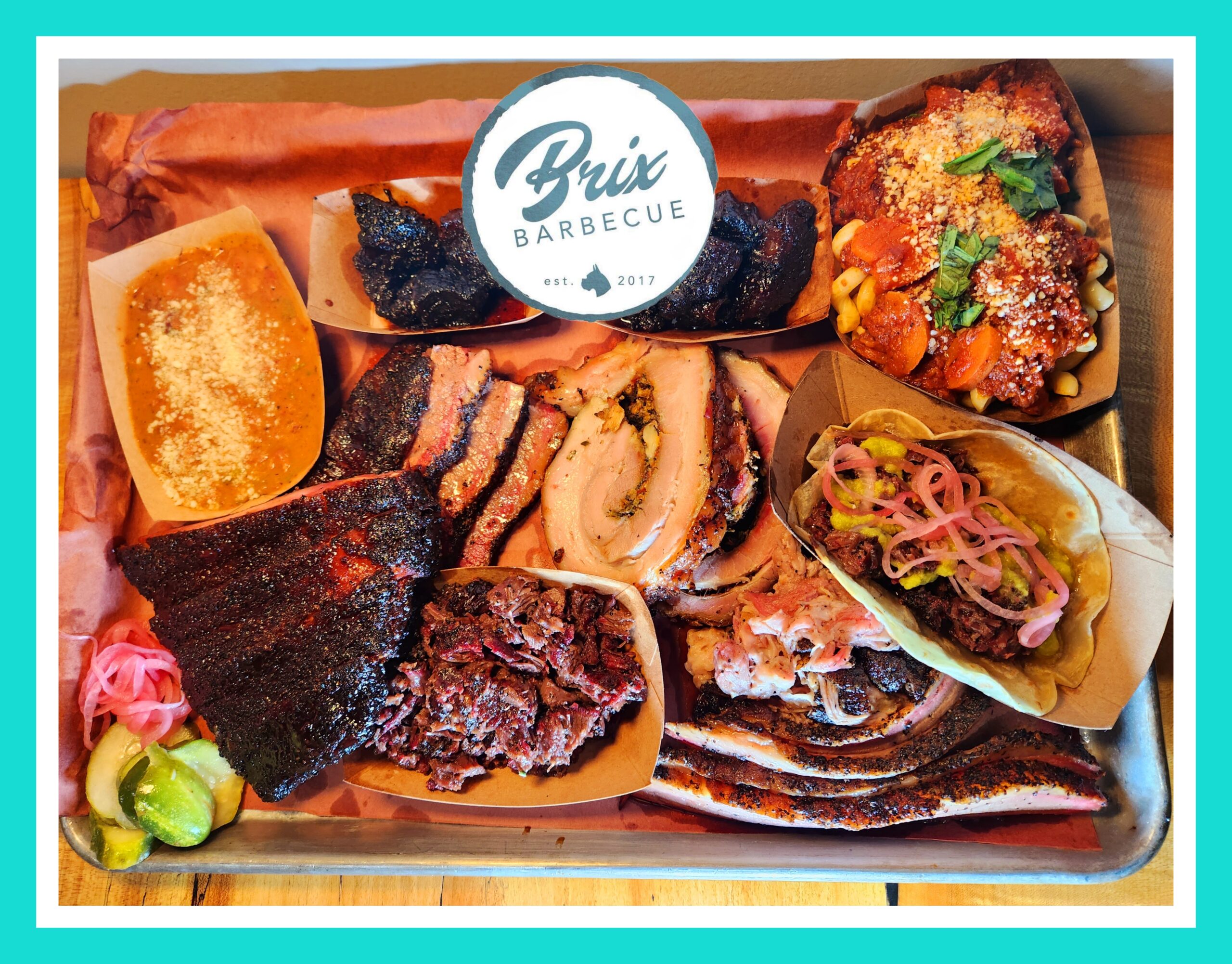 A tray of different types of food on top of a table.