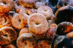 A pile of donuts covered in powdered sugar.