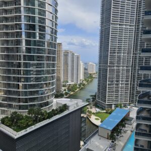 A view of some buildings and water from above.