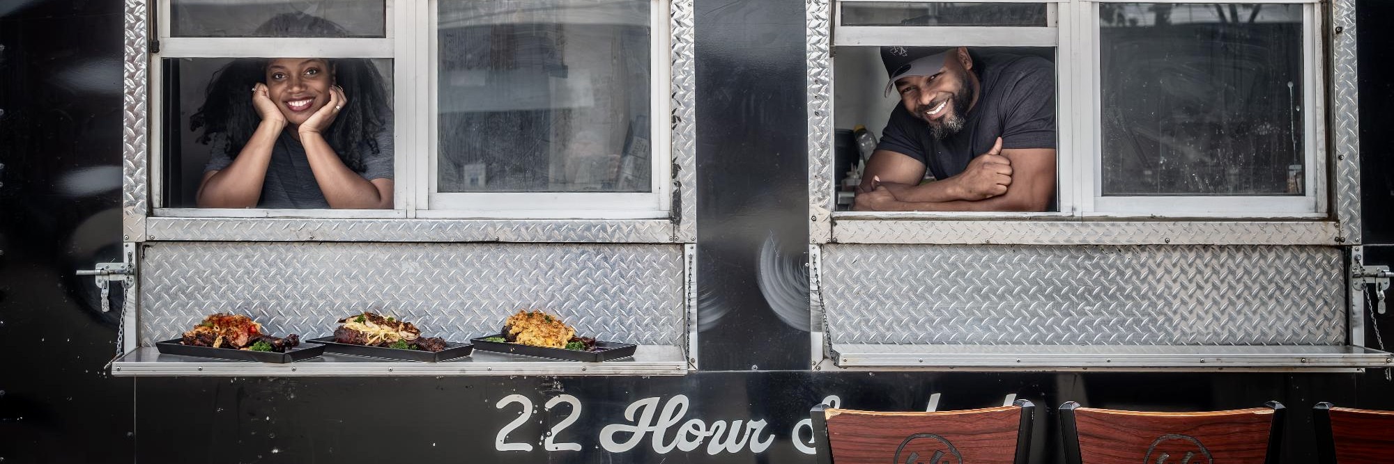 A person sitting in front of a window.